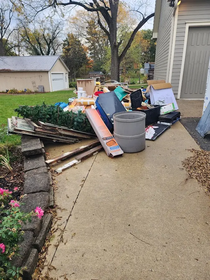 Dumpster being loaded with debris for Residential Dumpster Rental in Olean